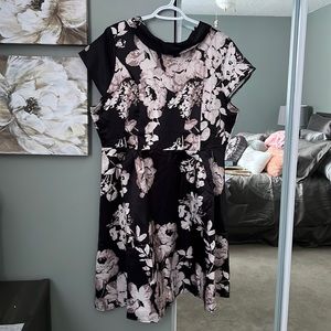 Never worn 50 styles dress with the collar at the front.